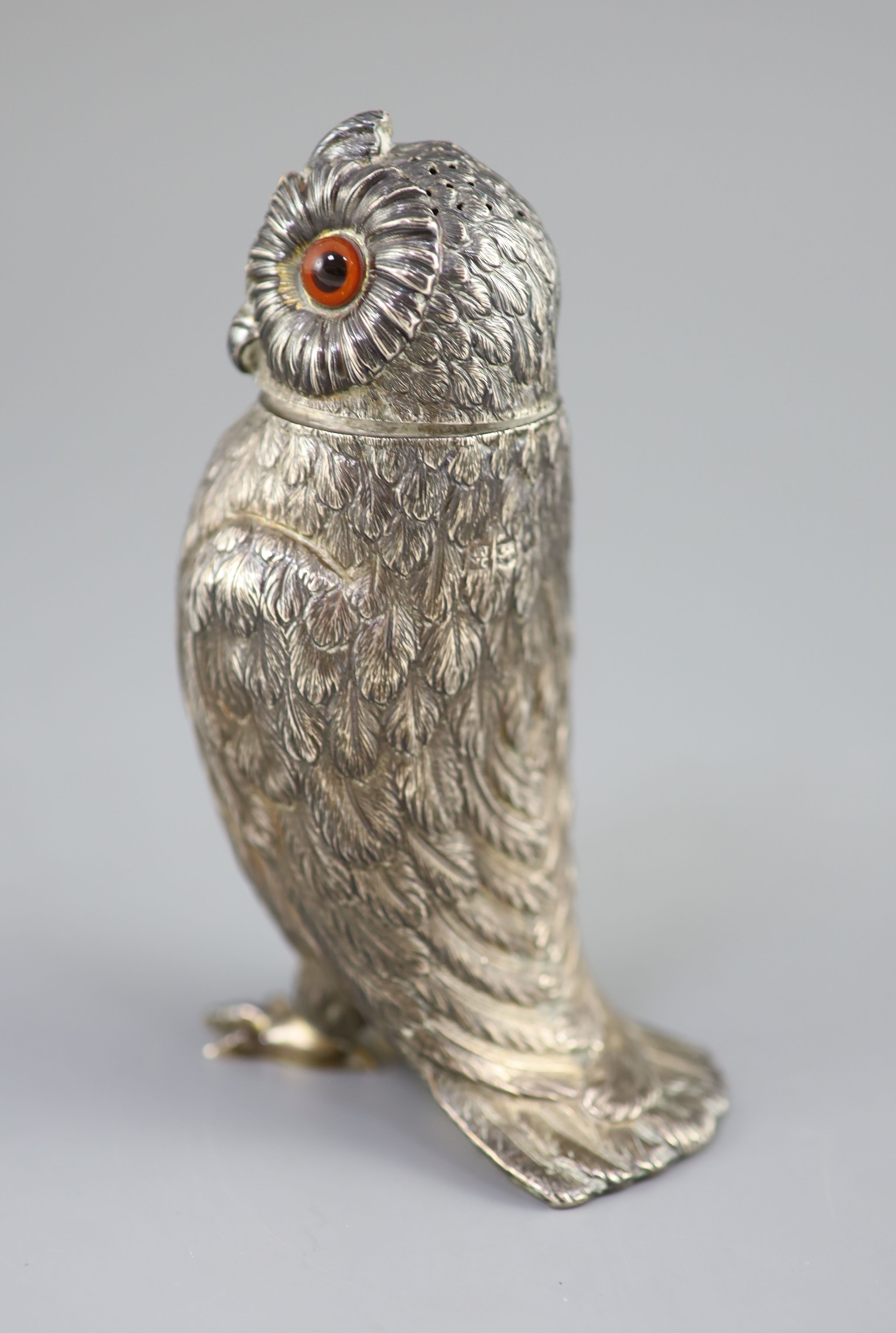 A Victorian silver owl sugar sifter, having chased feather decoration and removable head inset glass eyes,